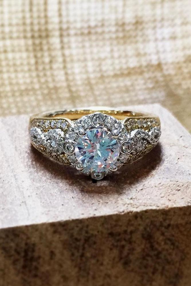 vintage engagement rings in yellow gold with halo round cut diamond