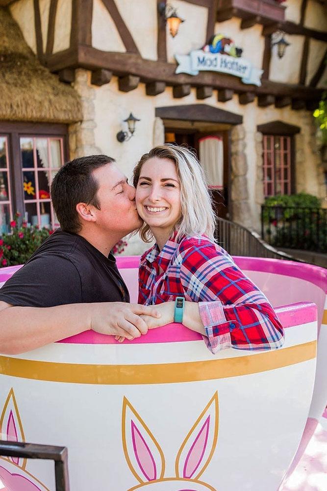 Disney proposals couple sitting in huge cup