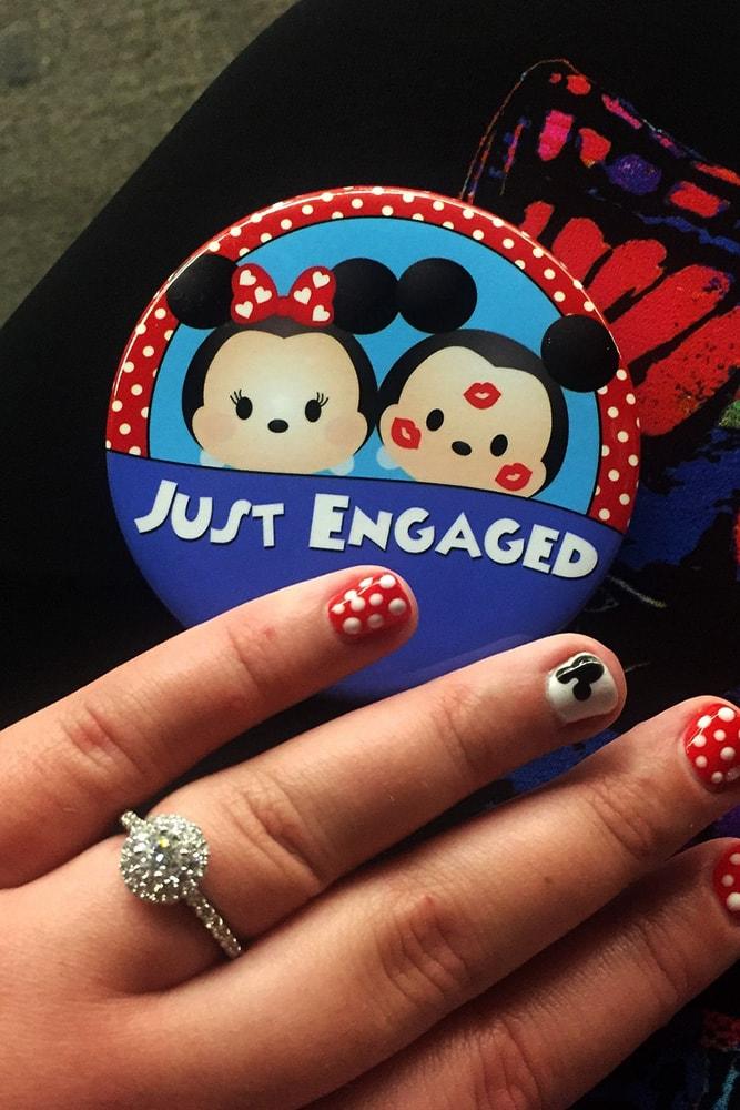 disney proposals ideas for inspiration hand with engagement ring and badge in disneyland style