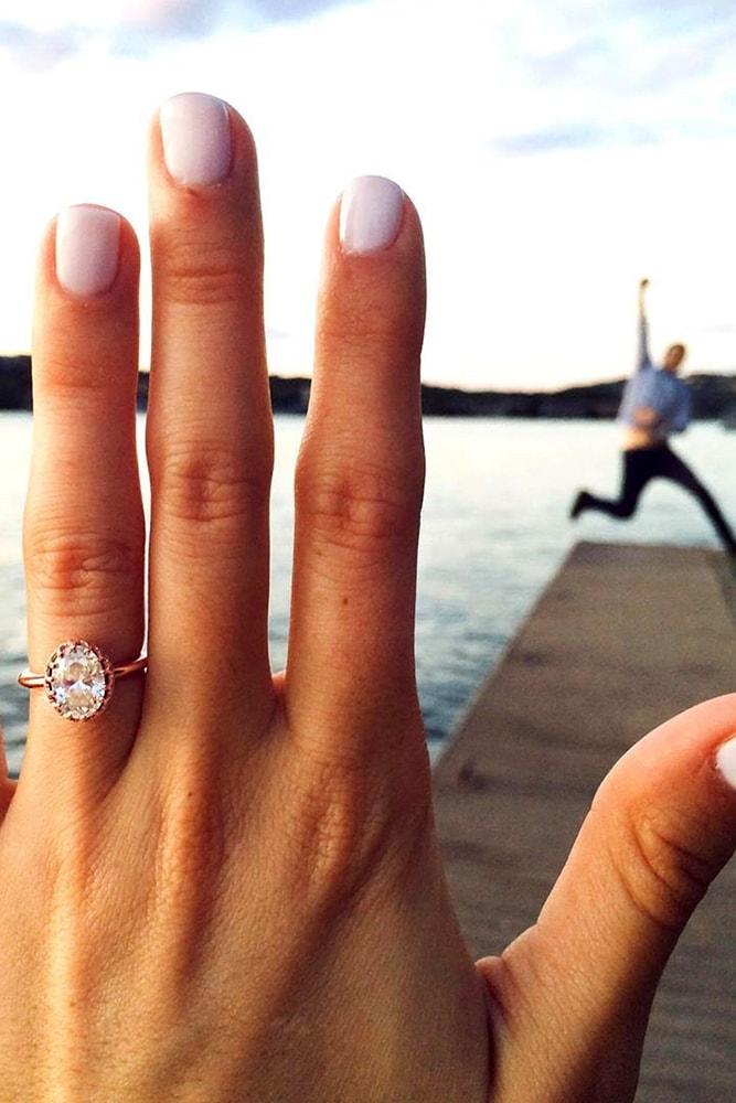 engagement photo ideas he is happy on the beach