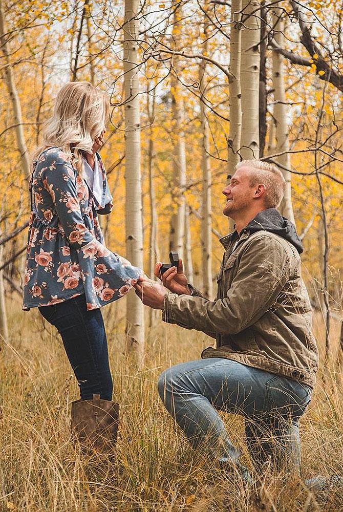 fall proposal ideas man propose a woman in the forest