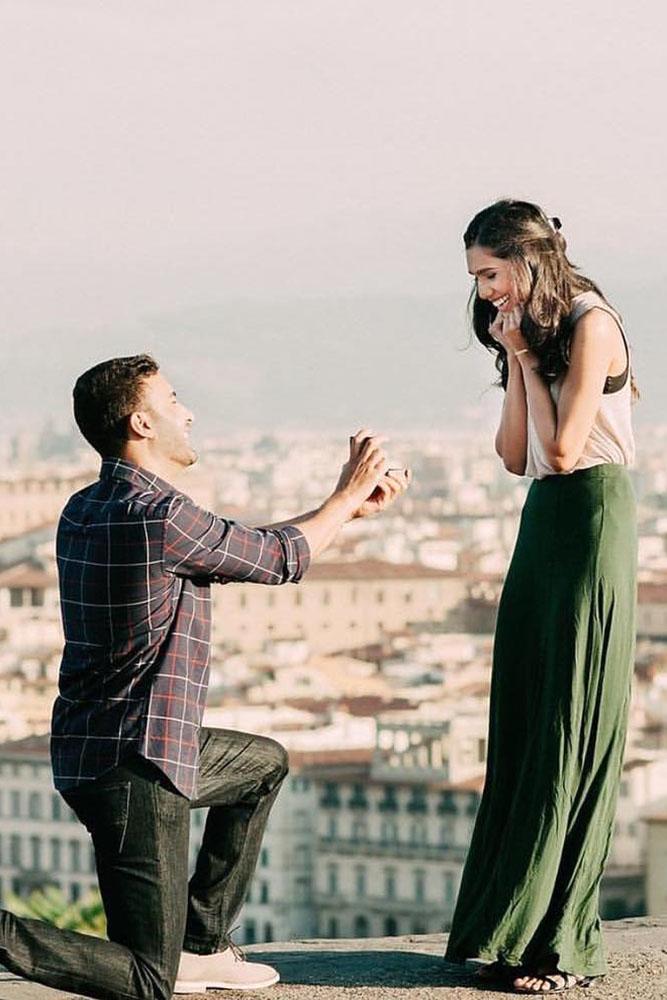 marriage proposal roof proposing in a city