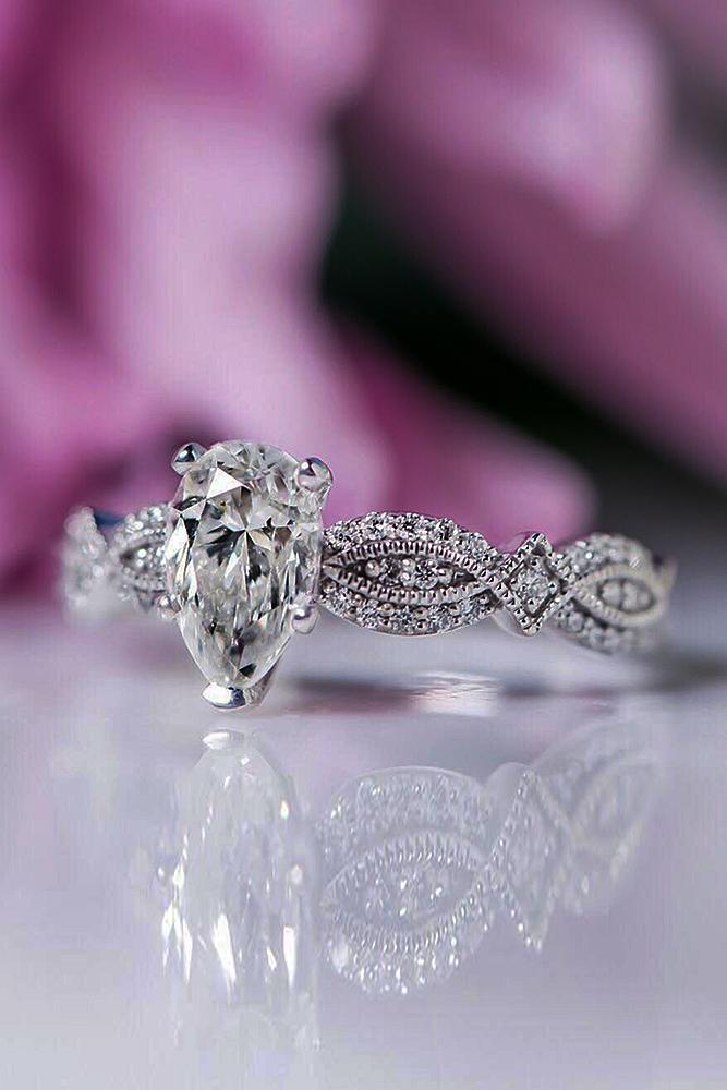 solitaire engagement rings diamond pear cut twist pave band