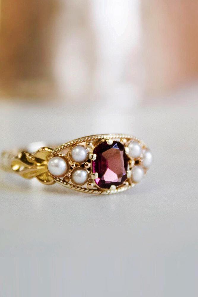 yellow gold engagement rings unique design cushion cut gemstone in the centre twisted pave band