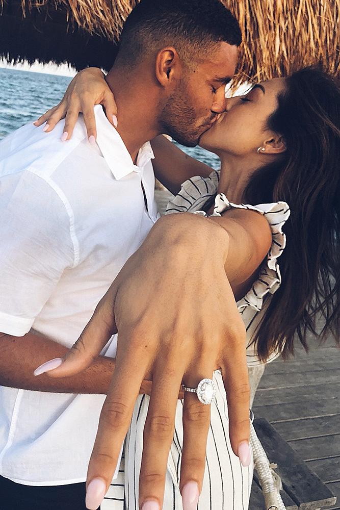 engagement photos proposal kiss ring on the finger white gold oval cut halo