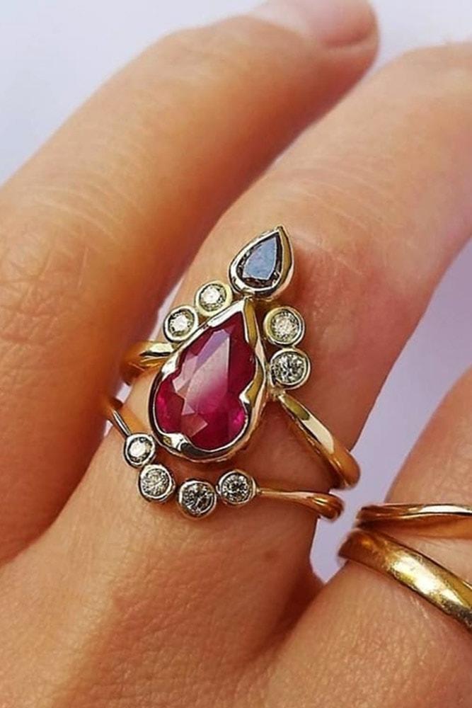 ruby engagement rings pear cut ruby yellow gold modern