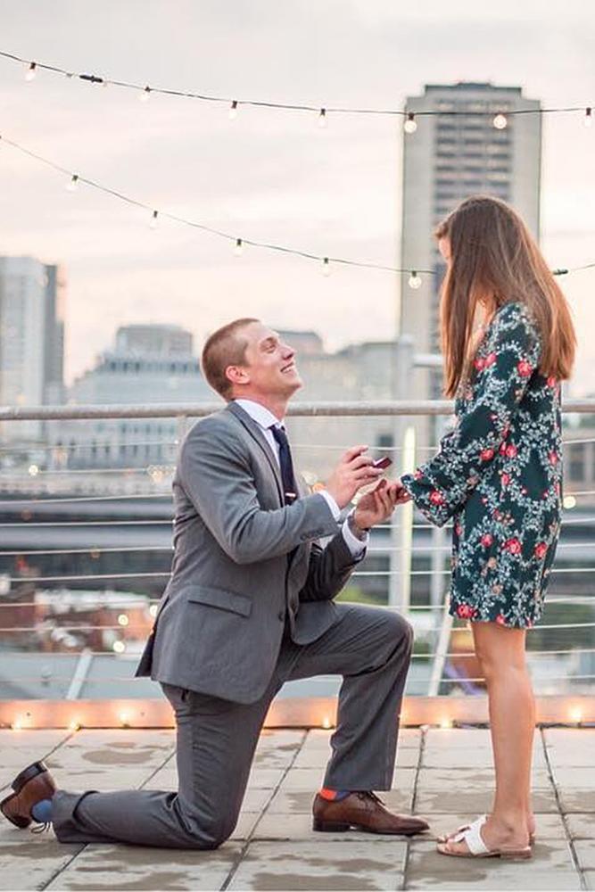 best proposals engaged couple on the roof