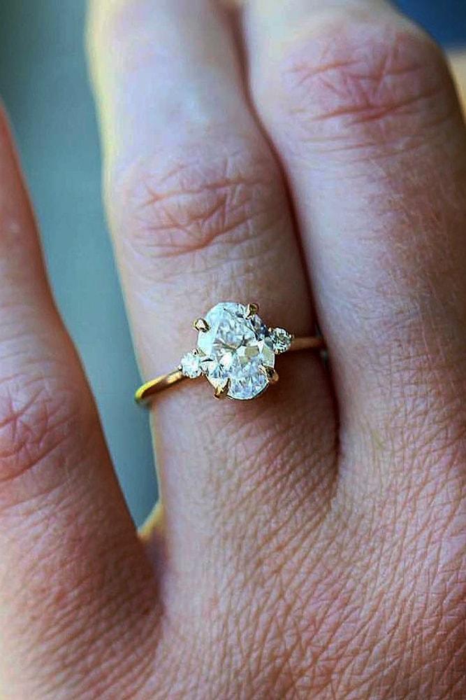 classic engagement rings stunning round cut diamonds and oval cut diamond in yellow gold pave band simple