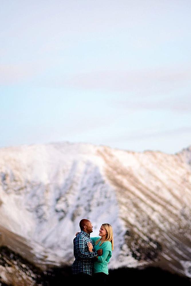 winter engagement photos mountains couple engaged