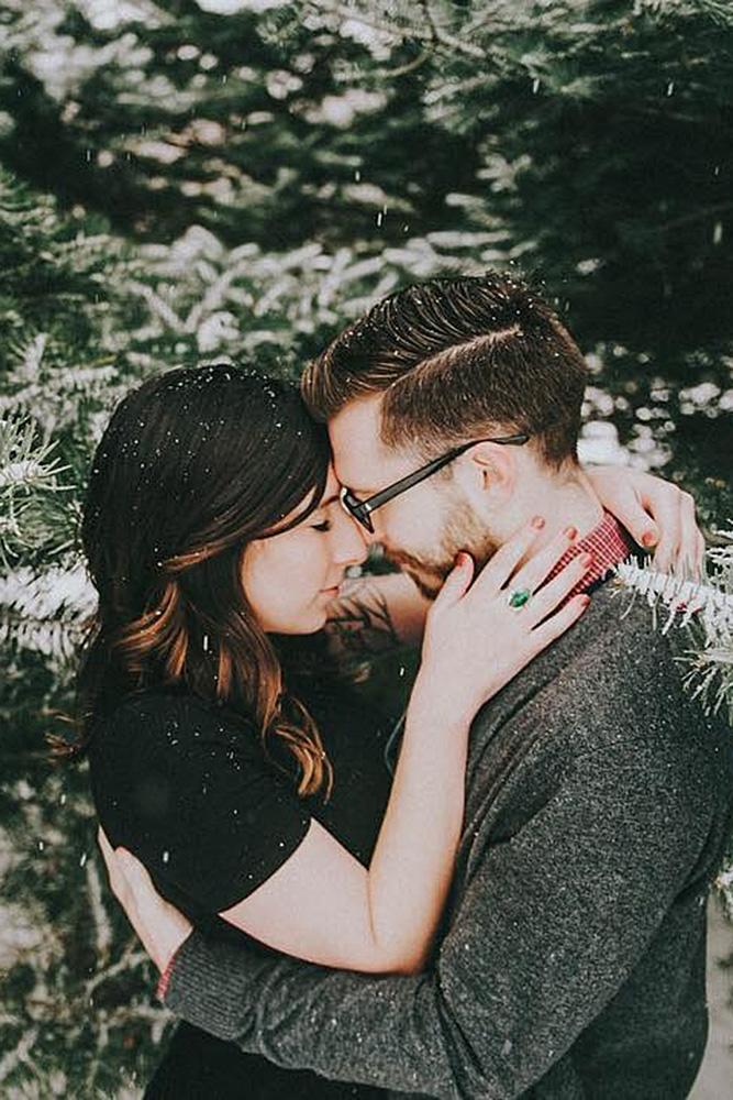 new year engagement photos engaged couple near the trees