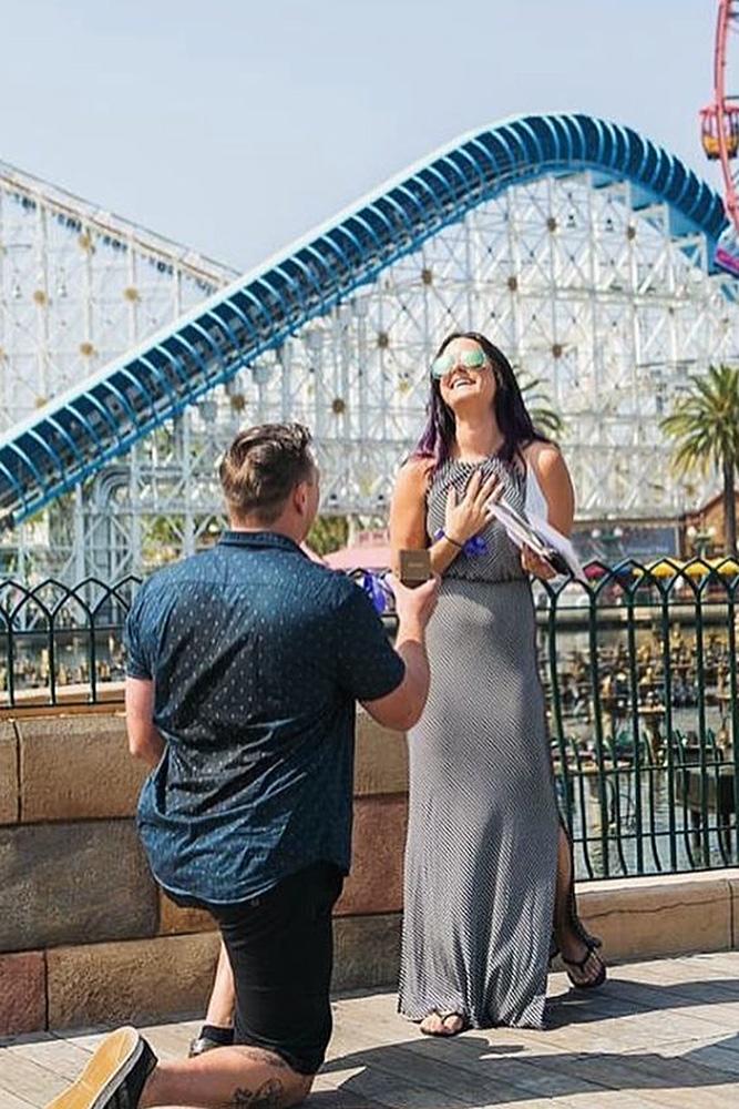 Disney proposal ideas man propose a woman near attractions
