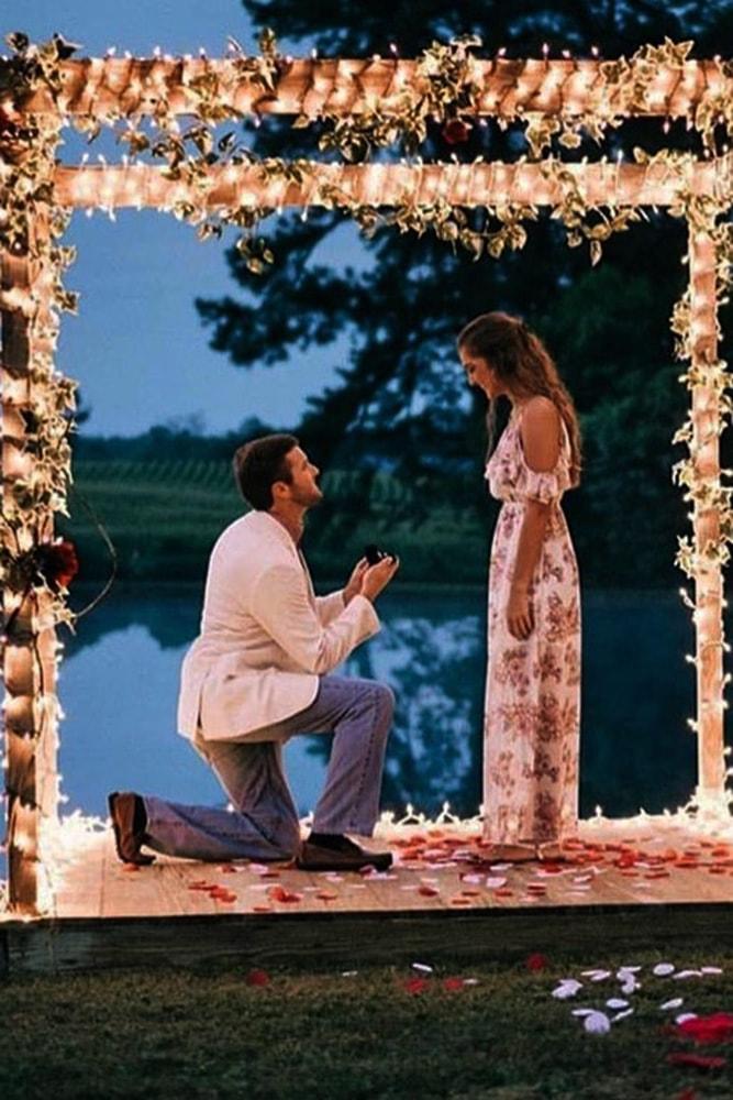 best proposal ideas fairy tale night time proposal ideas with flowers and lights on arbor near lake