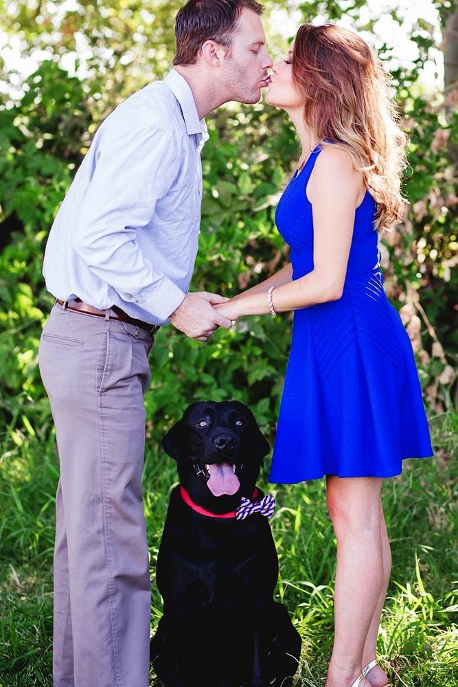 engagement pictures cute photo kiss engagement photo with animals dog