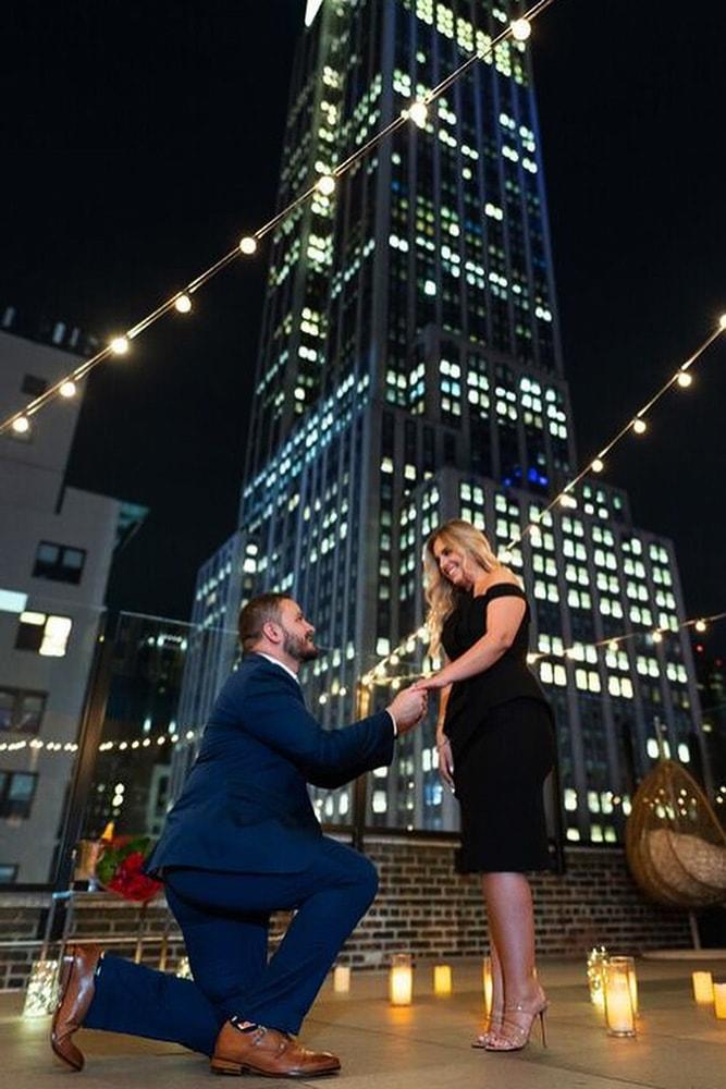 perfect proposals inspired night time roof proposals with lights and candles