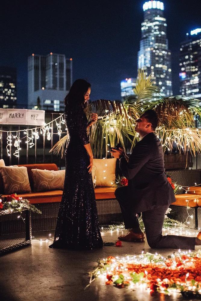perfect proposals inspired night time roof proposals with lights and flowers