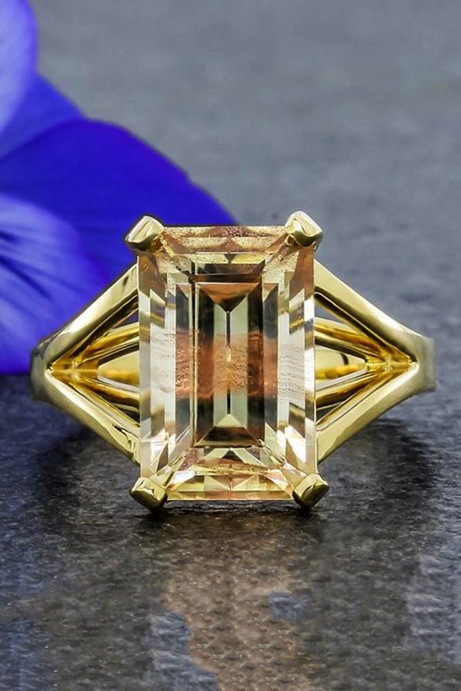 emerald engagement rings yellow gold emerald cut yellow diamond split shank