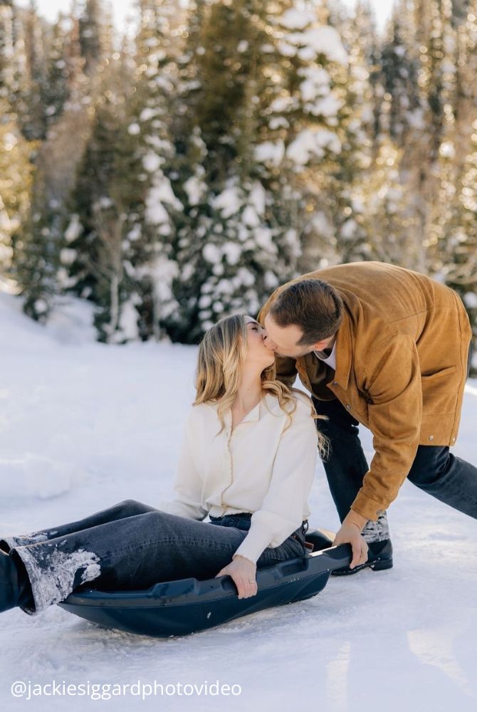christmas proposal lovers in nature she is riding on a sleigh fun proposal jackiesiggardphotovideo