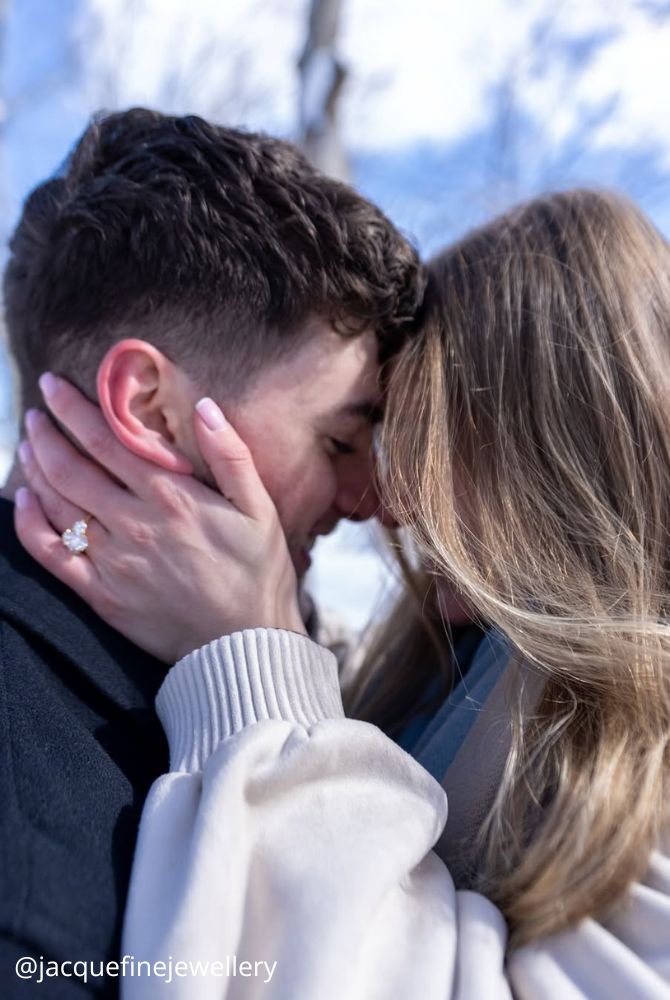 christmas proposal wedding ring on the hand hugs of the brides after the proposal jacquefinejewellery