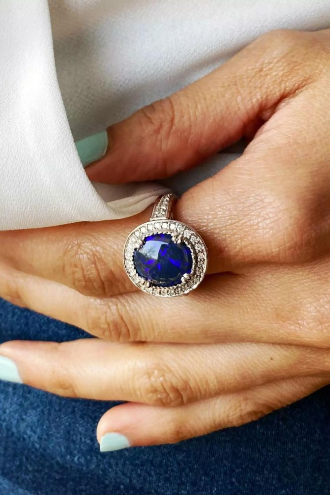 modern engagement rings with blue gemstones