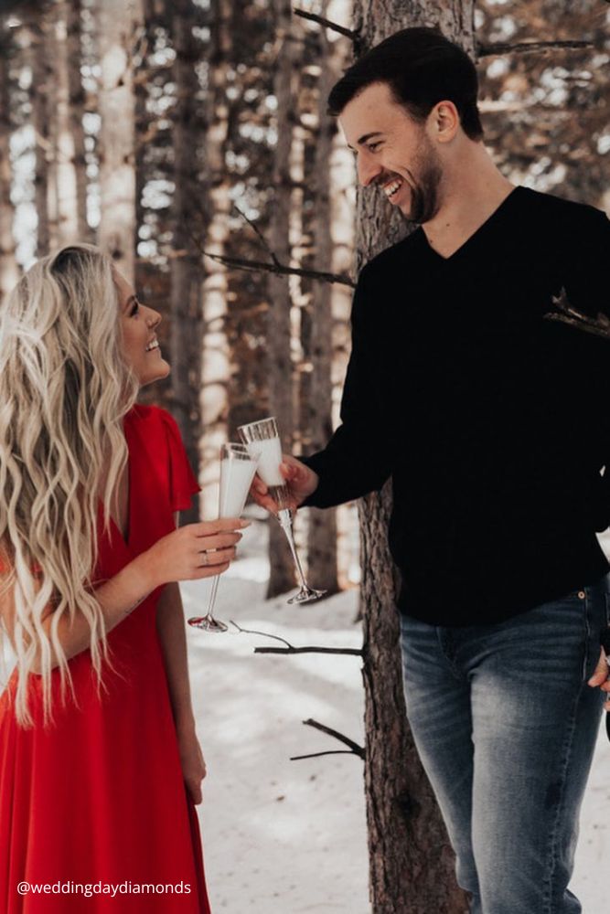 new year engagement photos a couple celebrating new year after engagement in nature with shampagne weddingdaydiamonds