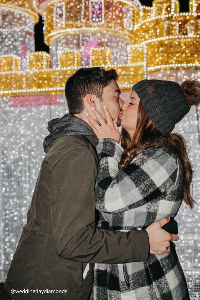 new year engagement photos couple kissing in the city at a fonf house with garlands after engagement weddingdaydiamonds