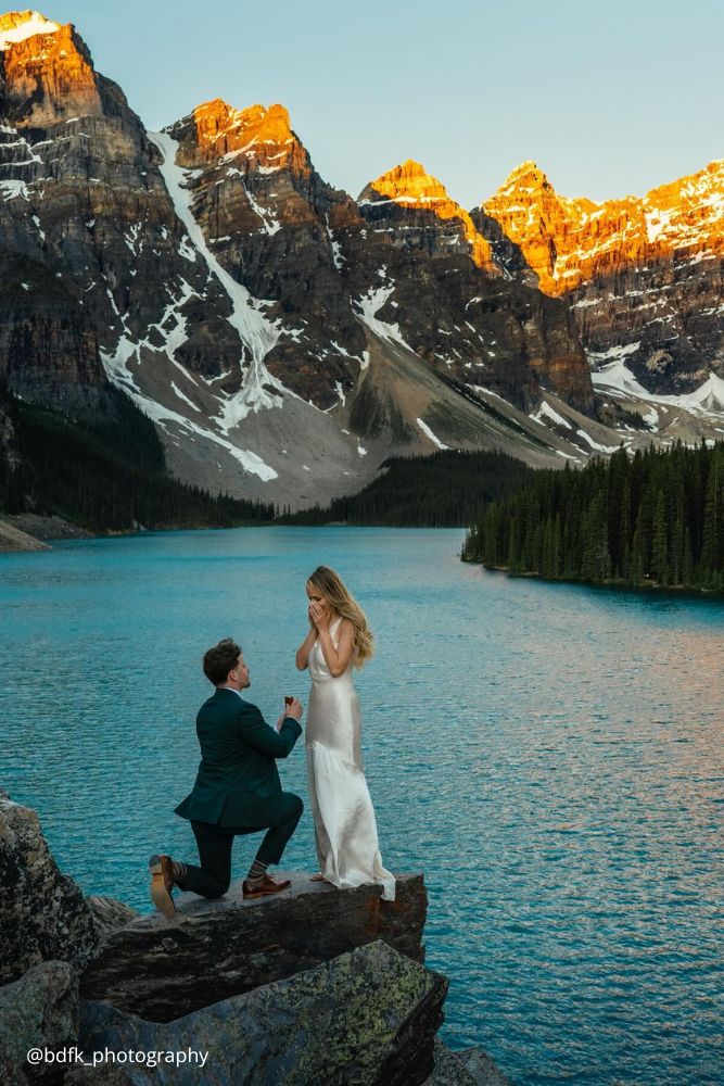 winter engagement photos guy proposes to a girl in a snowy mountains bdfk photography