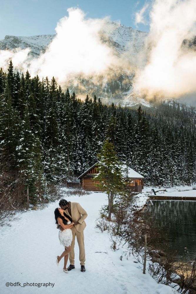 winter engagement photos kissing couple snowy forest on a background bdfk photography