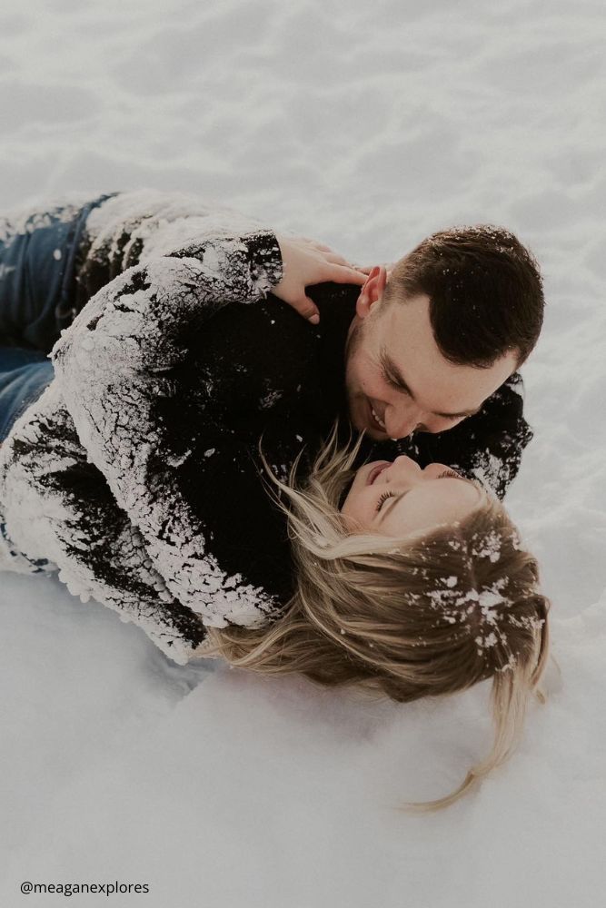 winter engagement photos love couple in the snow meaganexplores