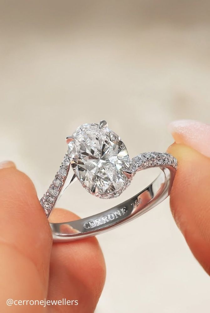 white gold engagement rings oval cut diamond ring with twisted pave band set in white gold cerronejewellers