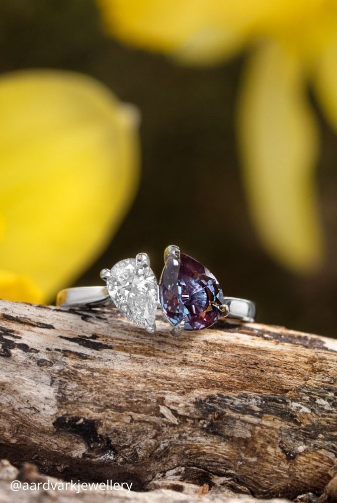 white gold engagement rings toi et moi ring featuring pear shaped diamond and purple gemstone in white gold aardvarkjewellery
