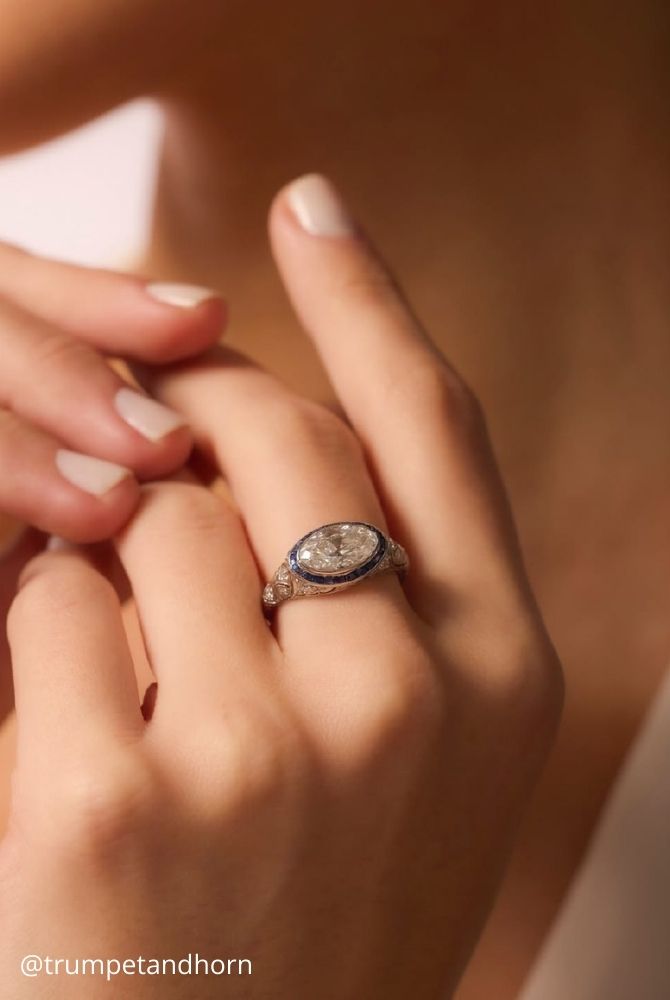 white gold engagement rings vintage inspired oval diamond ring with blue sapphire halo in white gold trumpetandhorn