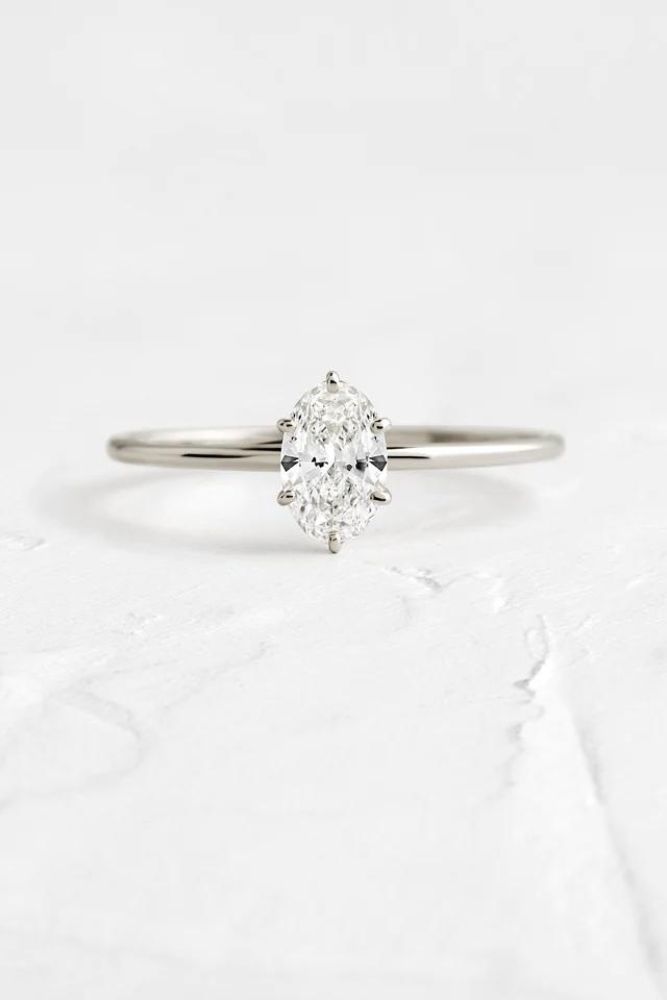 simple engagement rings oval center stone