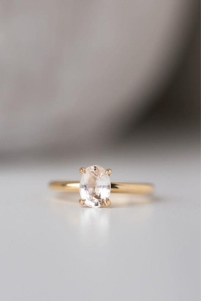simple engagement rings with oval center stone1