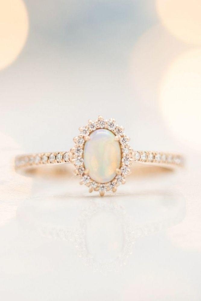 simple engagement rings with oval center stone