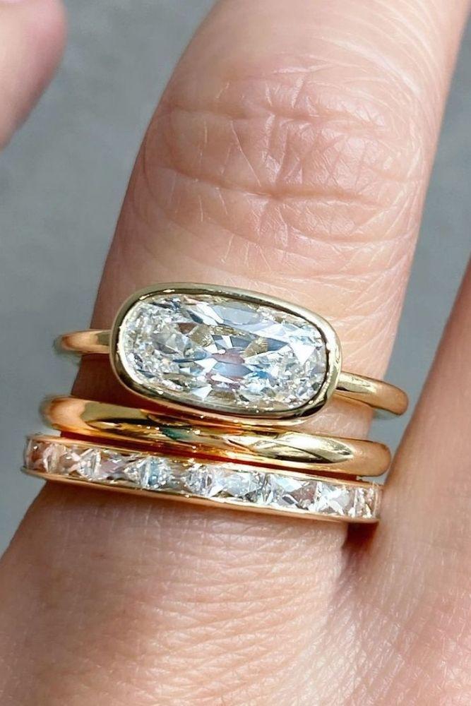 simple engagement rings with oval center stone