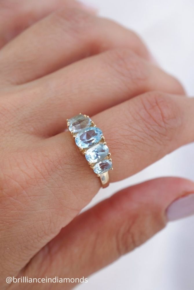 unique engagement rings five stone oval cut blue topaz eternity ring in yellow gold brillianceindiamonds