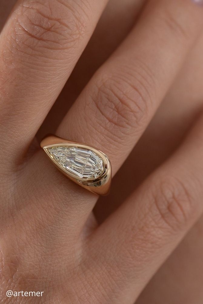 unique engagement rings pear cut diamond east west bezel set ring in yellow gold artemer