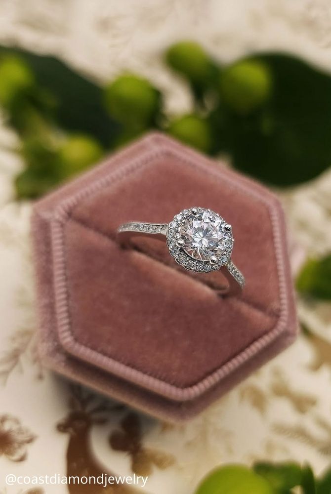 unique engagement rings white gold many stones diamond in the middle coastdiamondjewelry