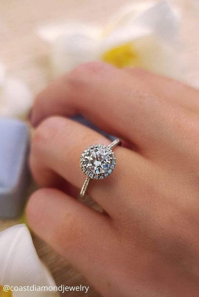 unique engagement rings white gold many stones diamond in the middle large stone coastdiamondjewelry