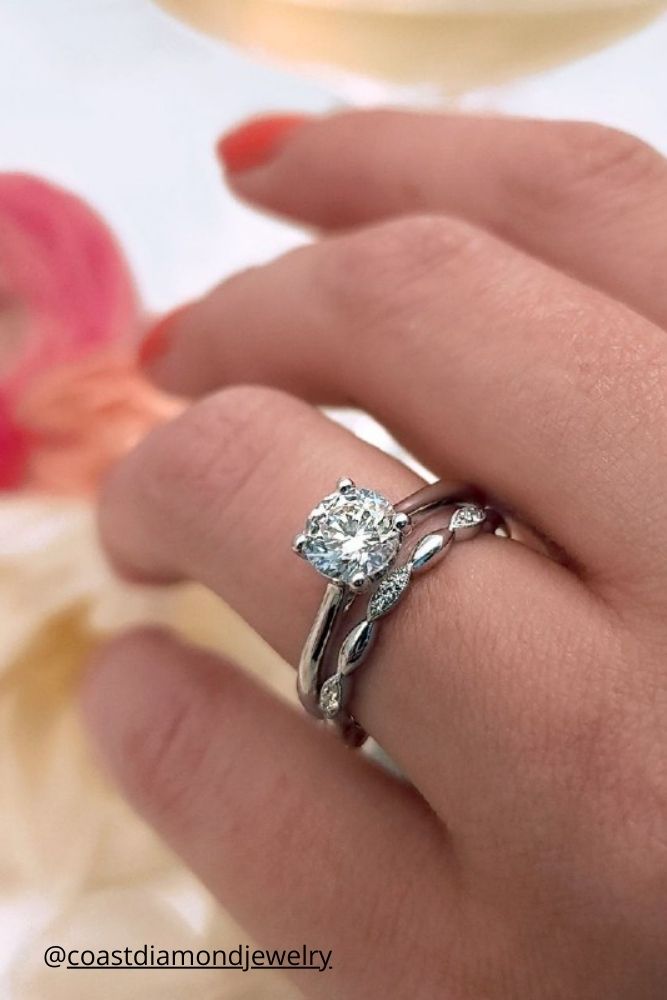 diamond wedding rings two rings with diamonds in white gold on the finger coastdiamondjewelry