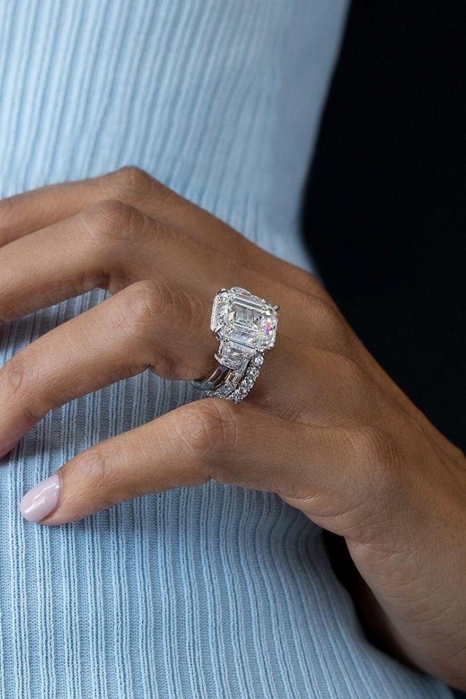 diamond wedding rings with emerald cut center stone