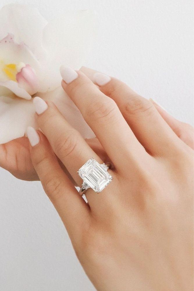 diamond wedding rings with emerald cut center stone