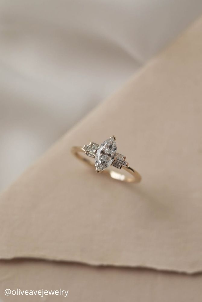 marquise diamond marquise center stone in v prongs and baguette stones bar prongs three stone basket oliveavejewelry