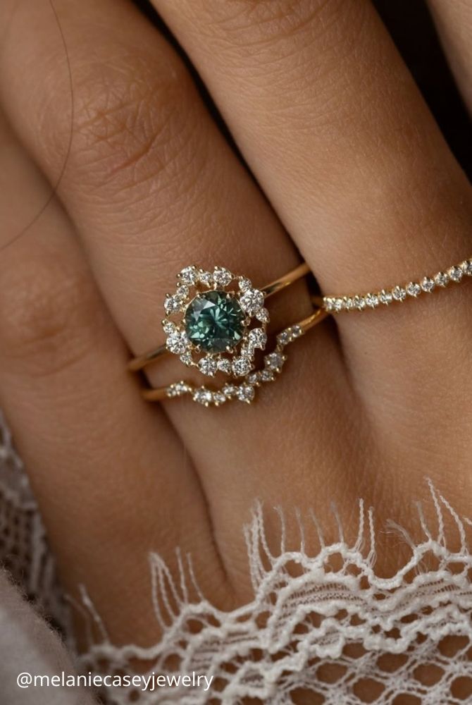 vintage engagement rings from yellow gold unusual vintage shapes delicate decoration green stones melaniecaseyjewelry
