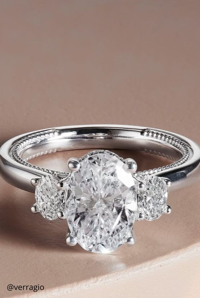 vintage engagement rings made of white gold special gentle design three shining stones verragio