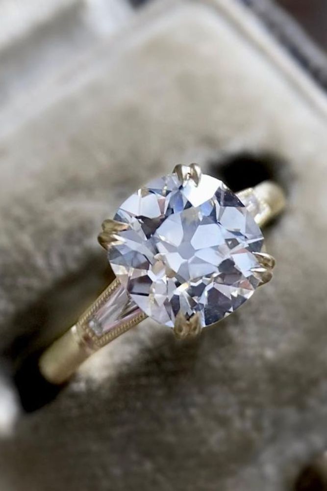 vintage engagement rings with round cut center stone