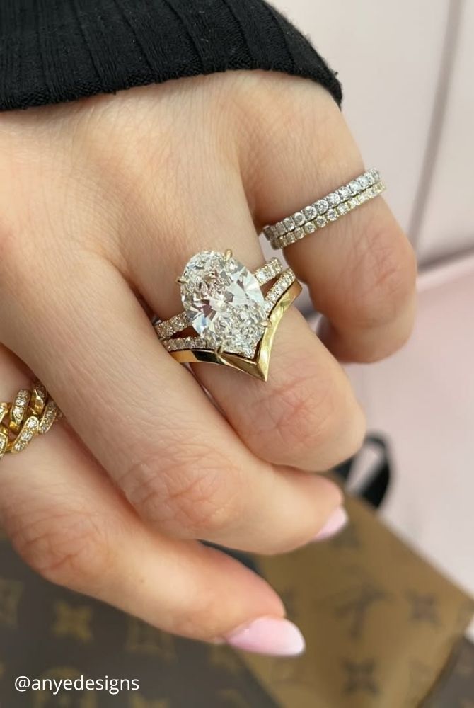 oval engagement rings oval cut diamond engagement ring styled with pointed gold chevron band anyedesigns