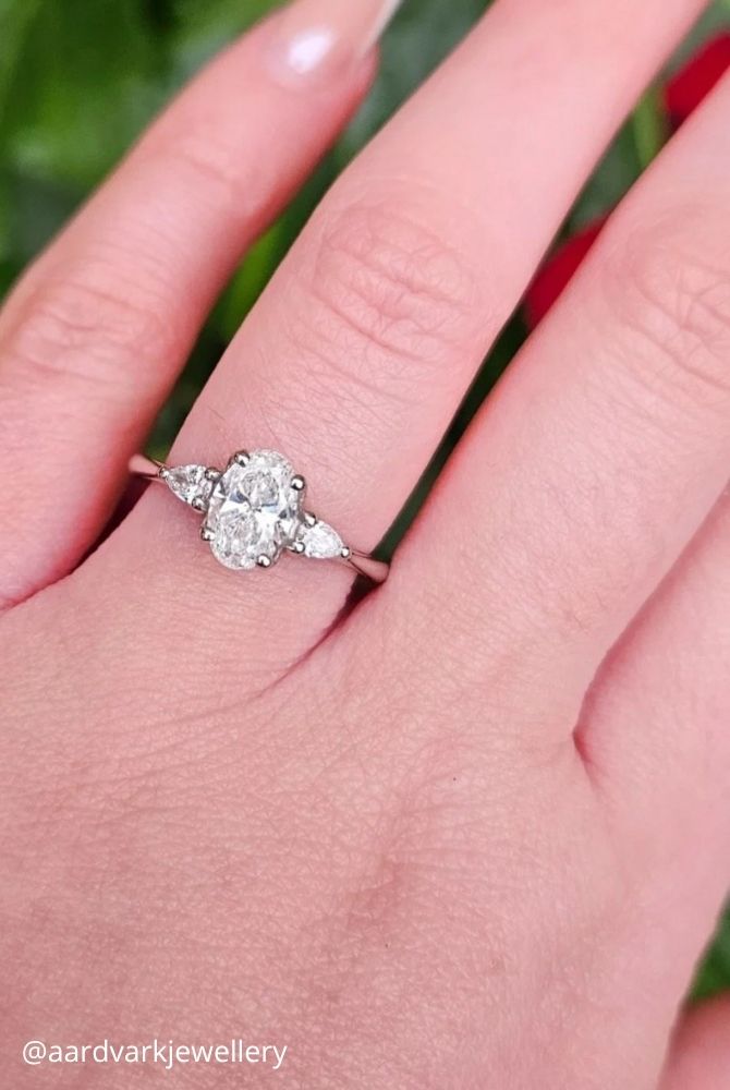 oval engagement rings oval cut diamond engagement ring with pear shaped side stones aardvarkjewellery