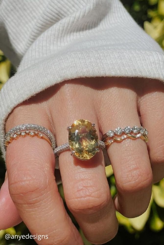 oval engagement rings oval cut yellow gemstone ring stacked with multiple diamond wedding bands anyedesigns