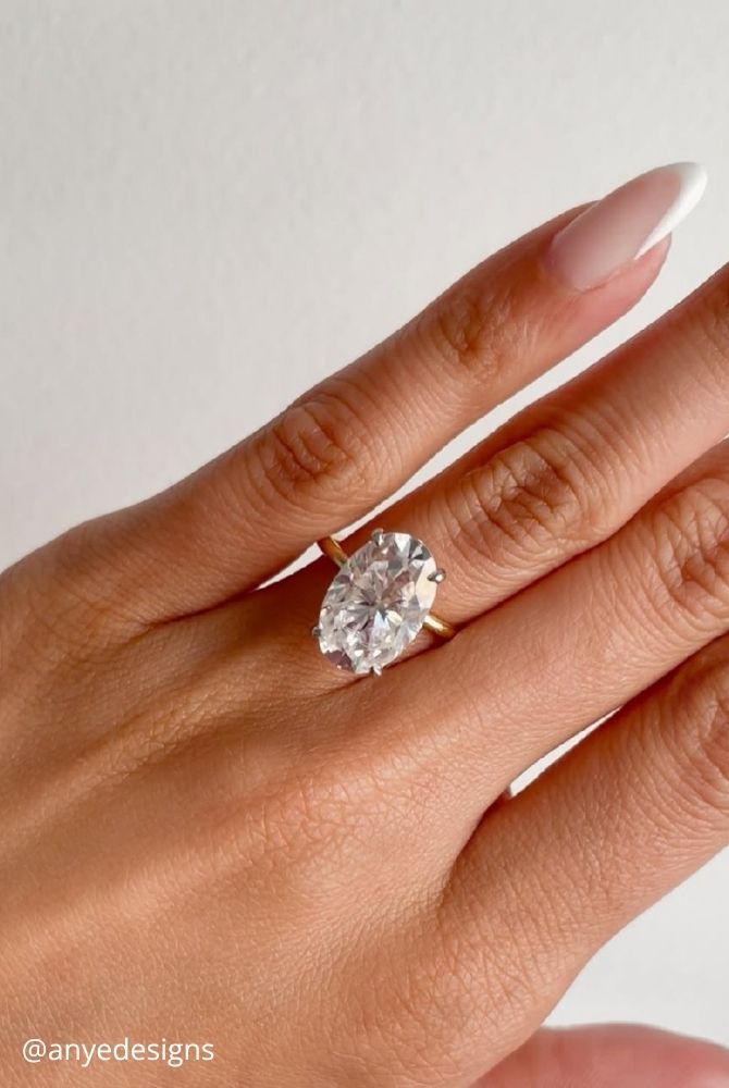 oval engagement rings simple and elegant solitaire oval cut diamond engagement ring on yellow gold band anyedesigns